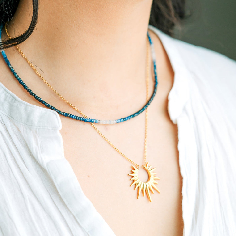 ombre shaded blue beaded necklace layered with gold waterproof sun pendant necklace 