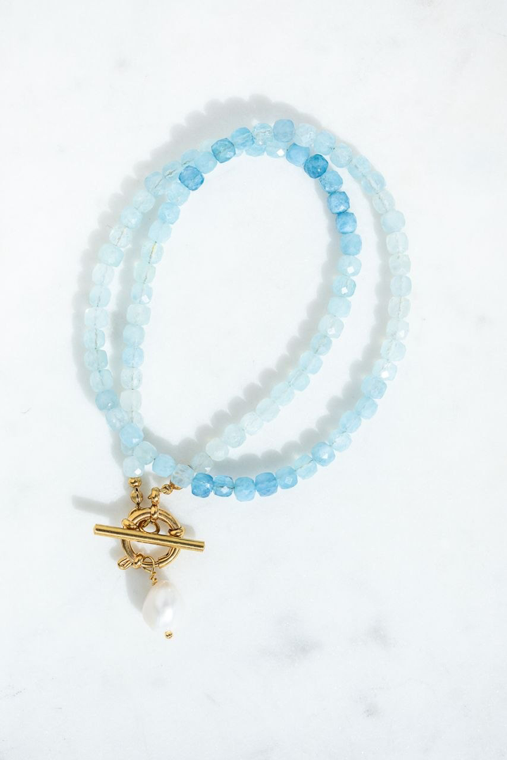 The Ombre Aquamarine Necklace with faceted cube aquamarine beads in soft,