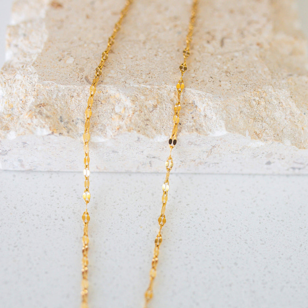 close up of a shiny gold chain necklace 