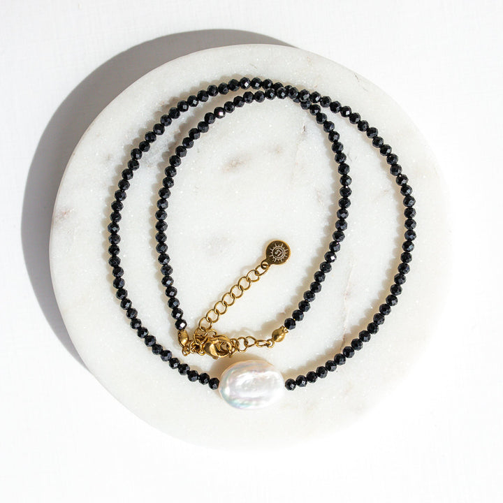 Baroque pearl necklace styled with everyday gold jewelry