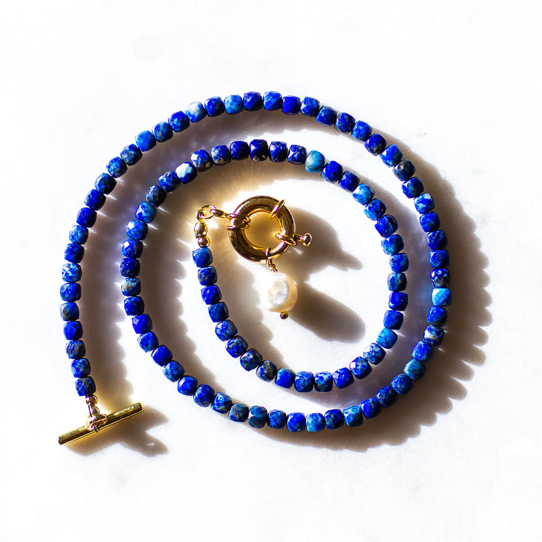 close up lapis lazuli beads deep blue gemstone necklace gold toggle clasp