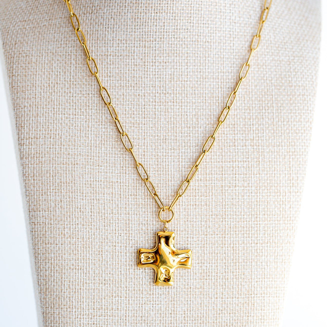 Chunky gold cross necklace worn on model — waterproof vacation jewelry 18K gold PVD statement piece