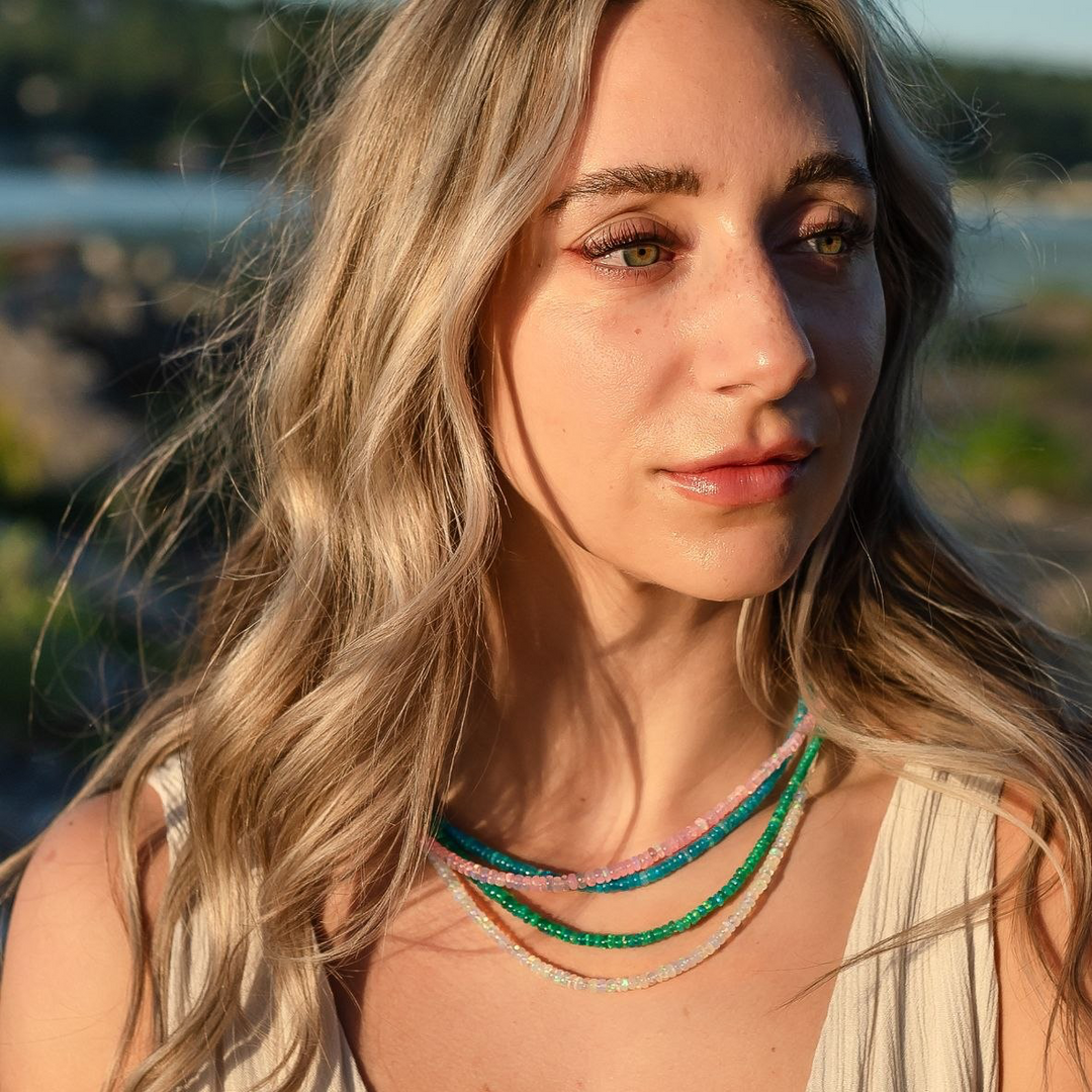Woman wearing a Ethiopian fire opal beaded necklace 