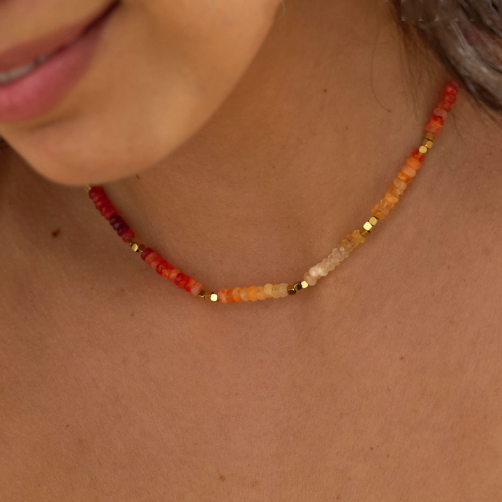 Fire opal ombre necklace layered with gold jewelry Luna and Salt on Model 