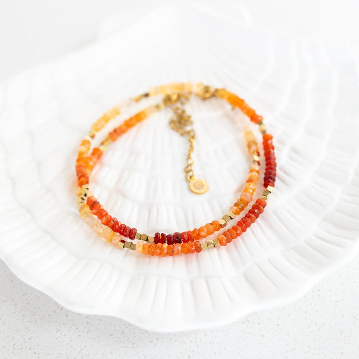 Mexican fire opal October birthstone necklace gold beads flat lay