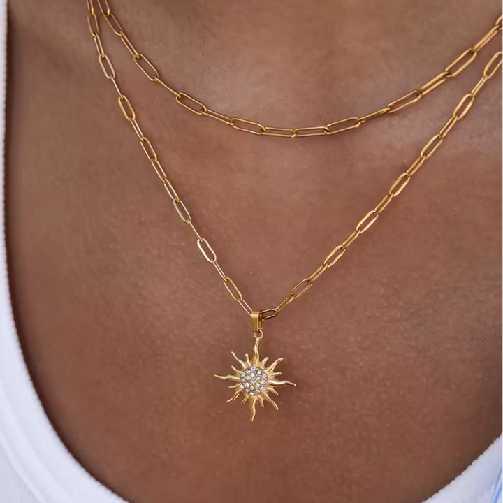 Layered gold sun necklace waterproof jewelry styled for beach vacation everyday wear
