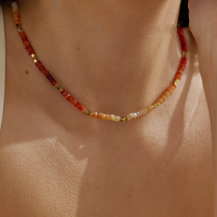 Mexican fire opal necklace worn on neck with gold sparkle beads waterproof jewelry