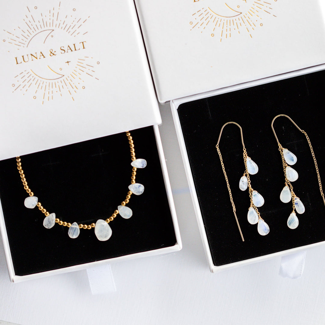 blue fire moonstone Jewelry set including necklace and earrings on display with 'Luna & Salt' branding.