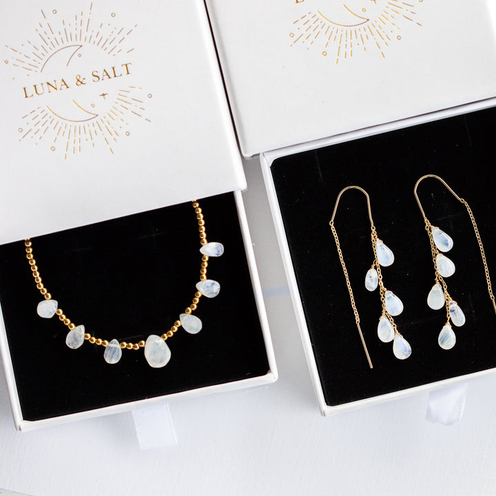 blue fire moonstone Jewelry set including necklace and earrings on display with 'Luna & Salt' branding.