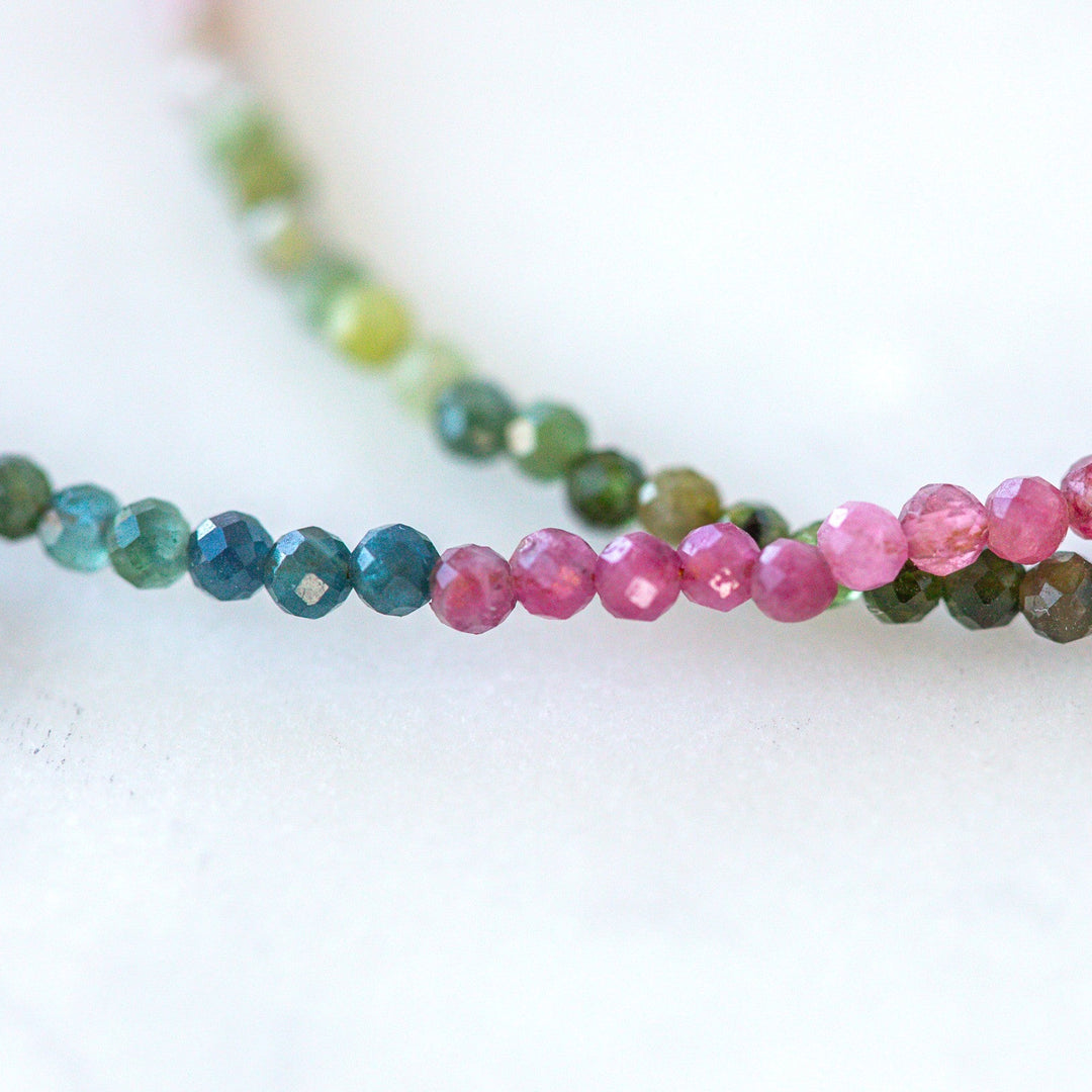atermelon tourmaline October birthstone necklace gold flat lay