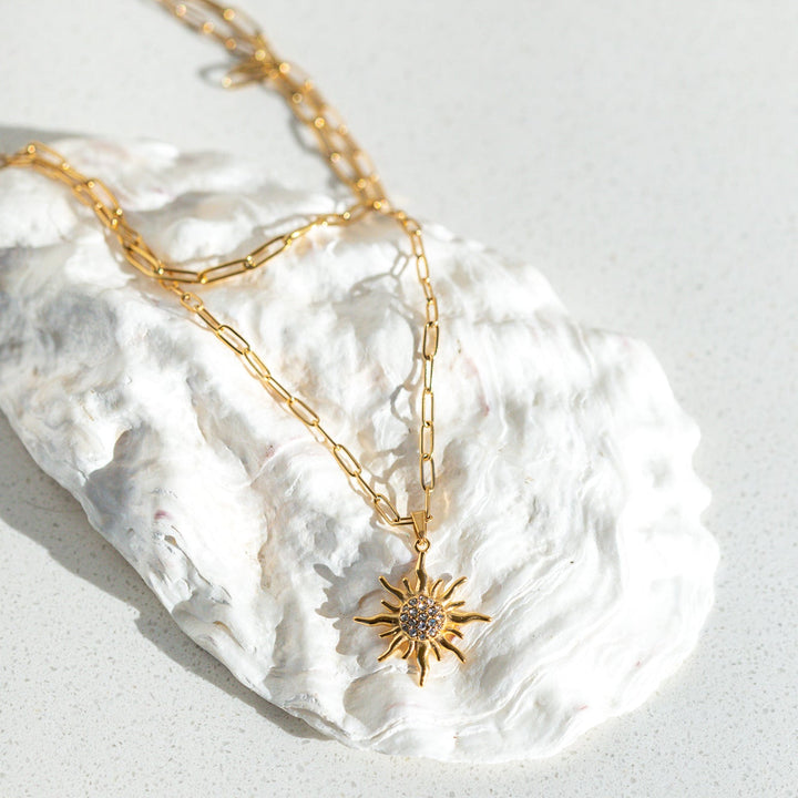 Waterproof gold necklace worn layered with sun pendant lightweight everyday jewelry